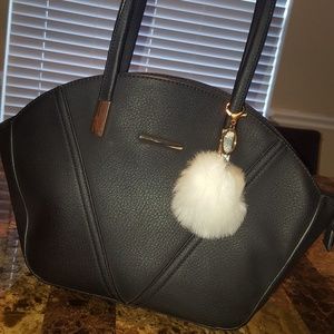 Black purse with white fur keychain
